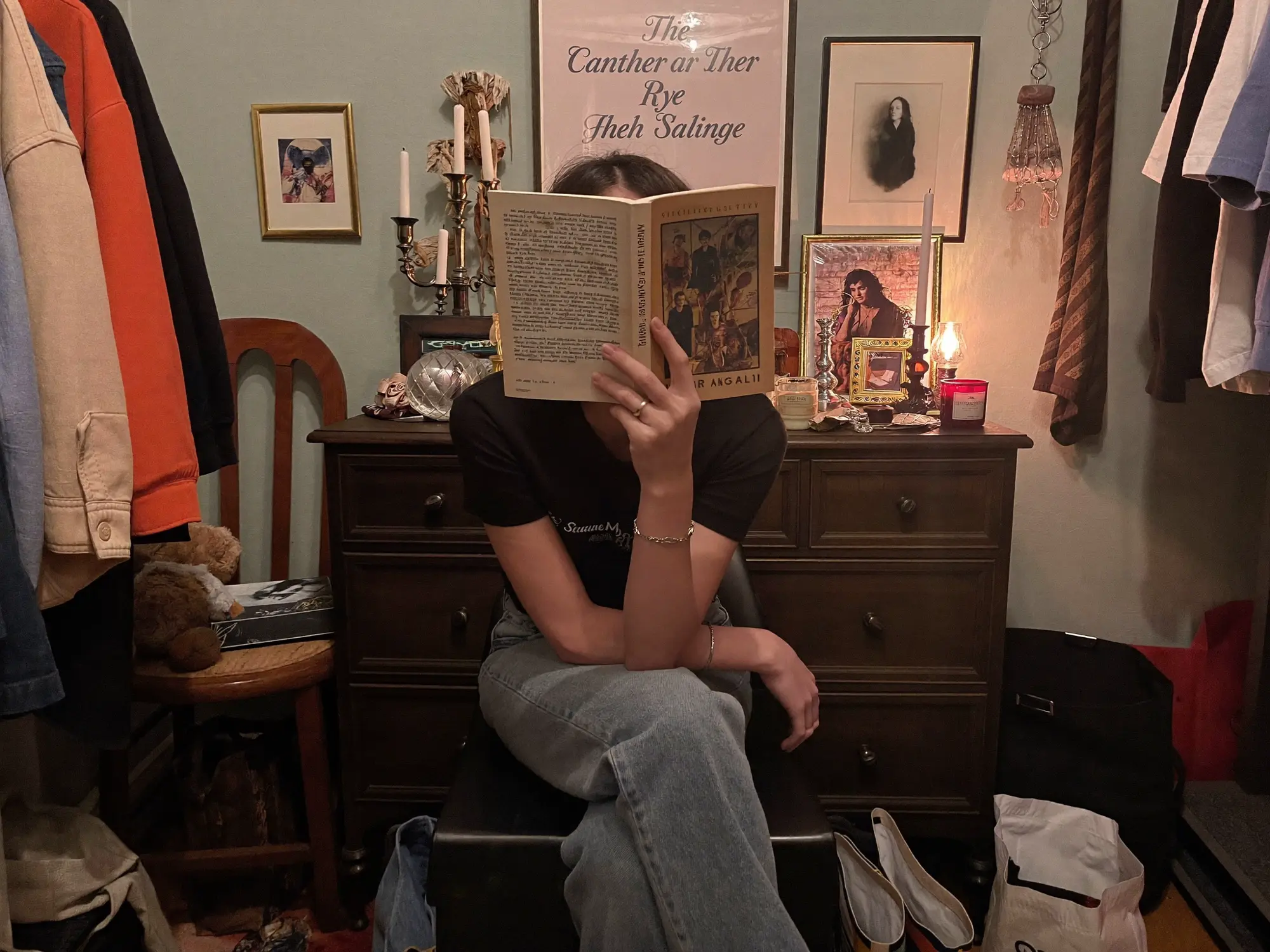 Person reading in a room filled with personal objects